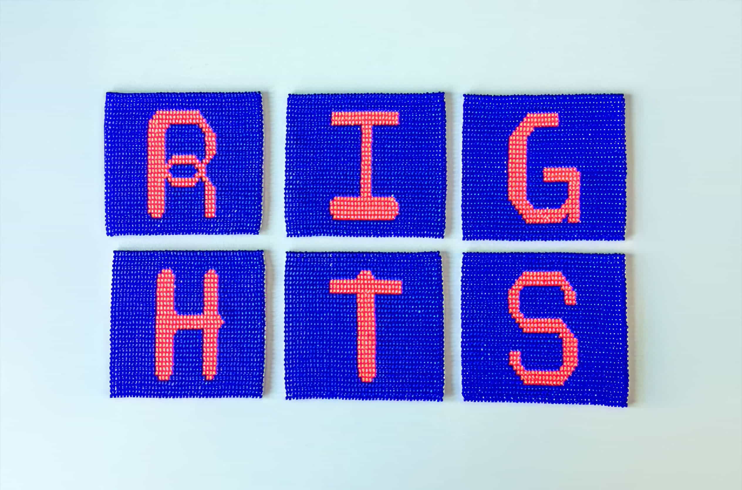 Six square panels with beaded blue backgrounds and large, orange beaded letters on each, spelling 