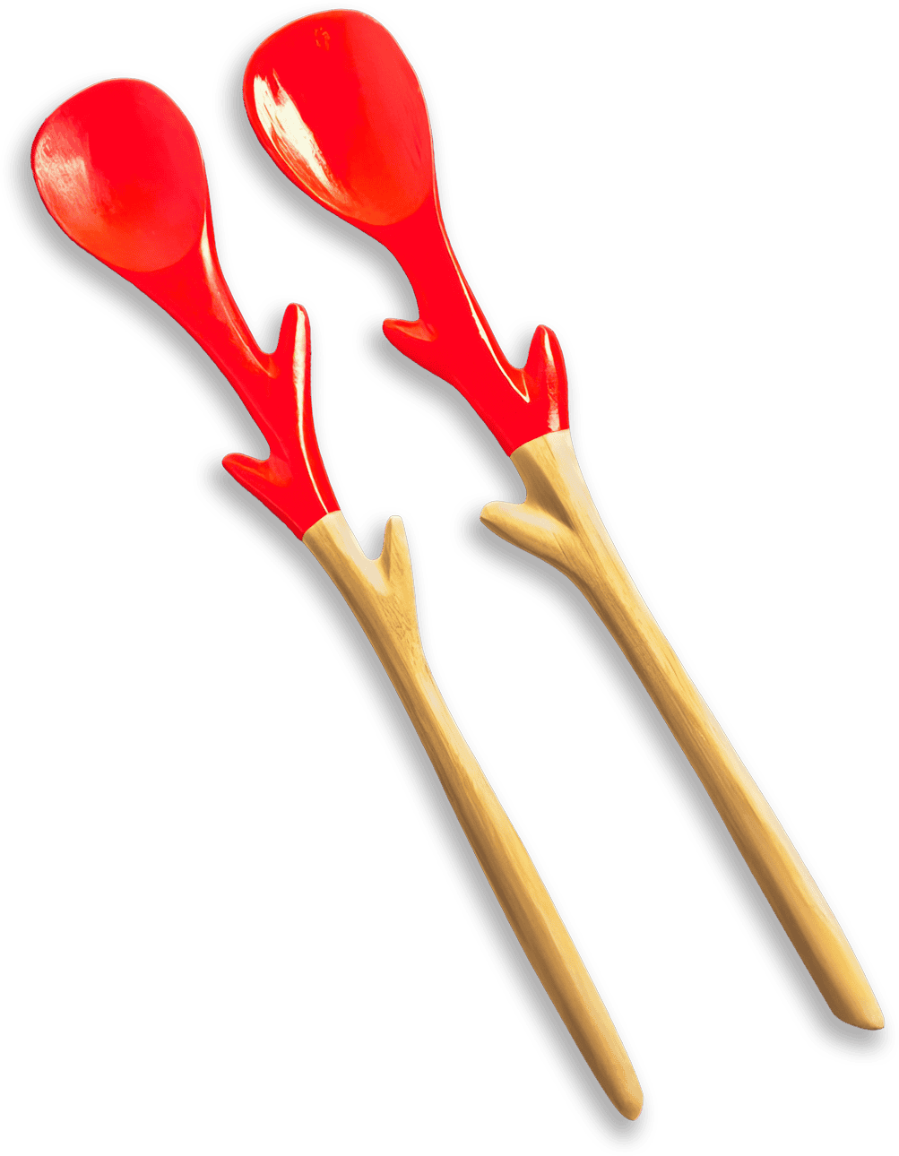 Two wooden salad servers with smooth handles and red, antler-shaped designs extending from the neck to the rounded spoons. The background is solid black, making the red and wood tones stand out vividly.