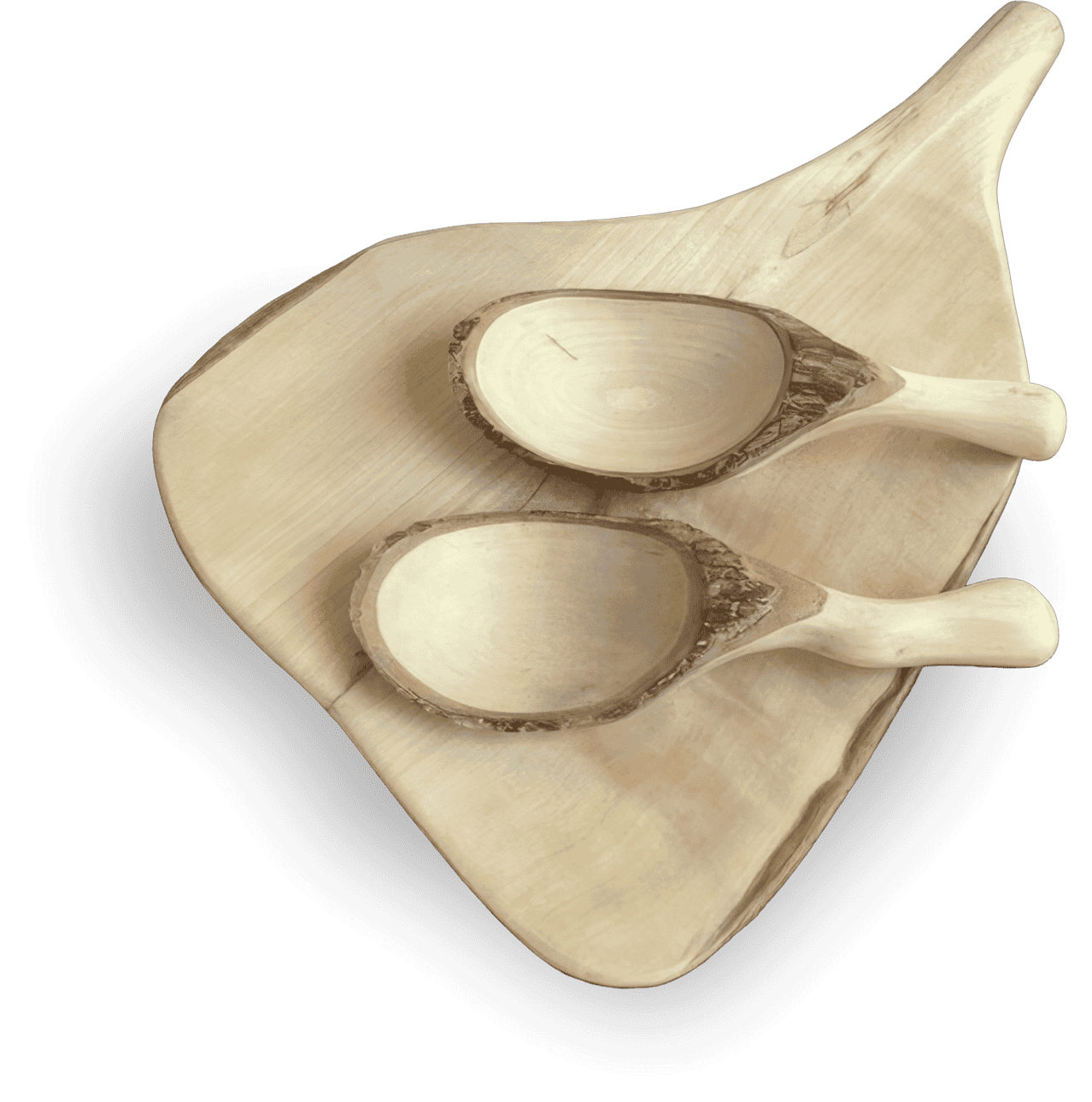 Two rustic, hand-crafted wooden scoops with light handles and rough bark edges rest on a smooth, irregularly-shaped wooden chopping board against a black background.