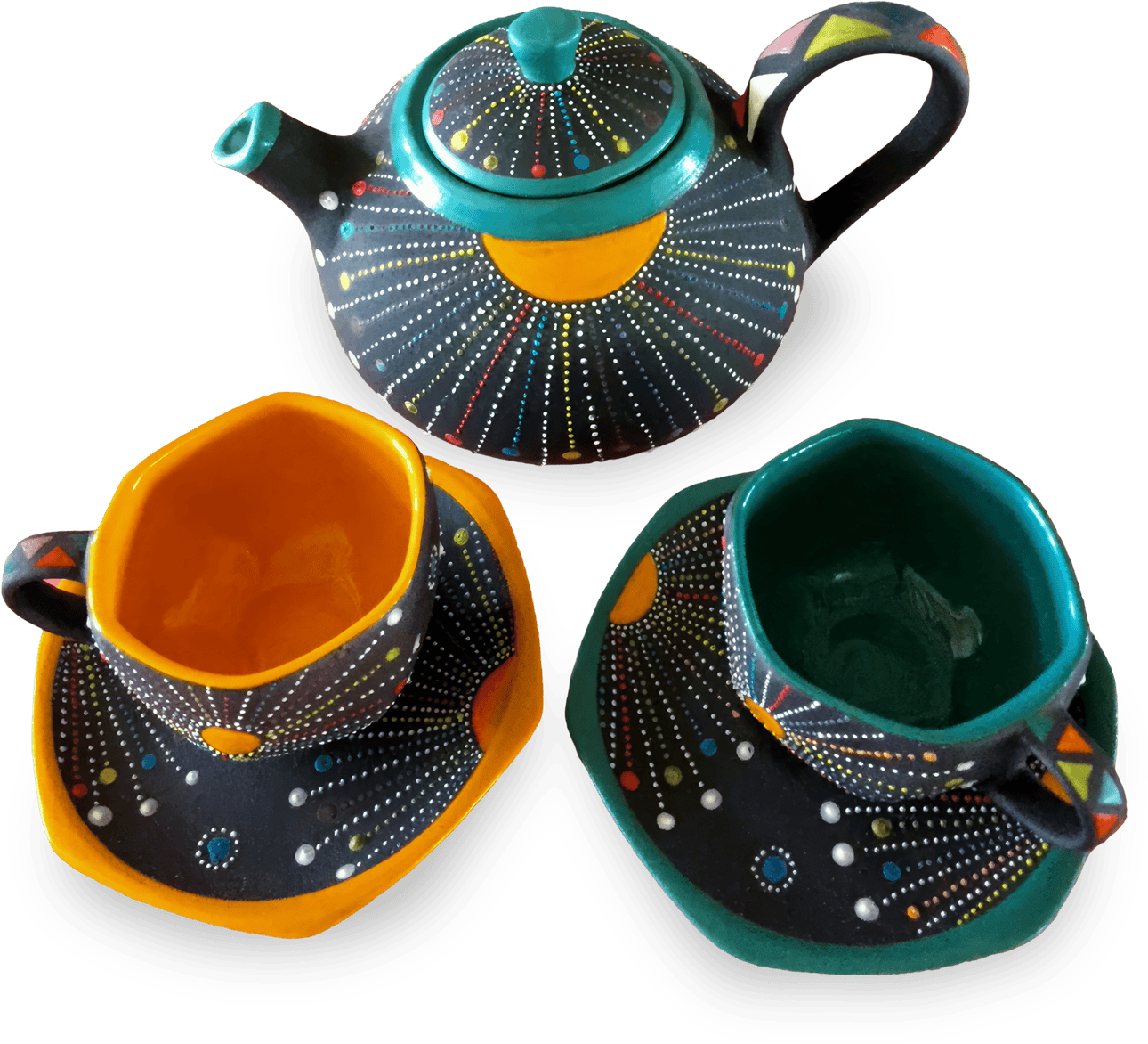 A colourful ceramic tea set with a teapot, two cups, and matching saucers. The set features black backgrounds decorated with dotted patterns in white, yellow, red, blue, and green, radiating like fireworks. The cup interiors are teal and orange.