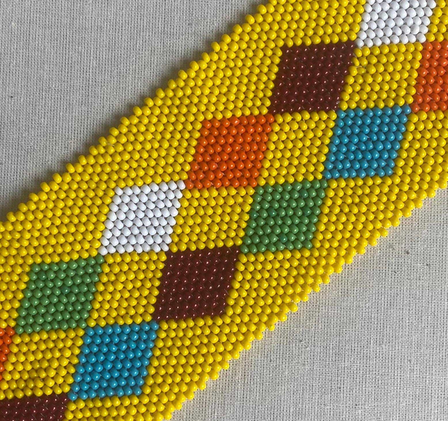A bead bracelet with a diamond pattern, inspired by the Weight of Silence collection from Contra.Joburg.